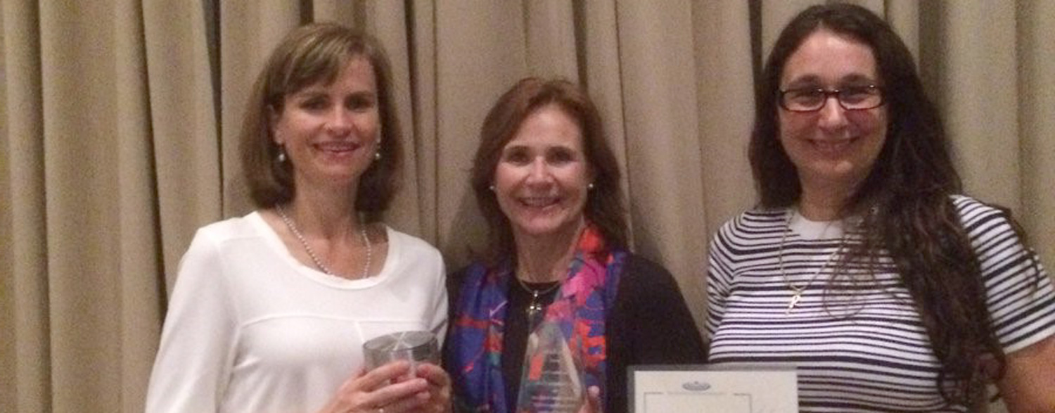 Jo Leonardi-Bee, Fiona Bath-Hextall and Catrin Evans receiving an award