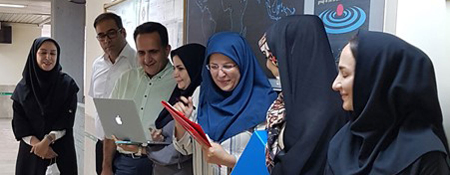 Sakineh and team meet in a hospital hallway.